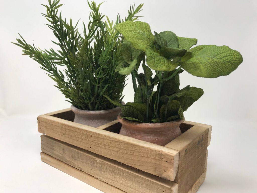 Aztec pots in wooden tray pictured with faux mint and rosemary herbs 